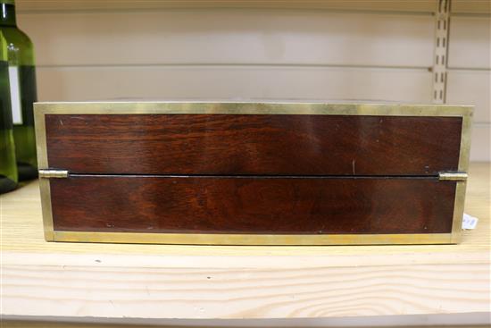 A Regency coromandel banded mahogany writing slope length 36cm